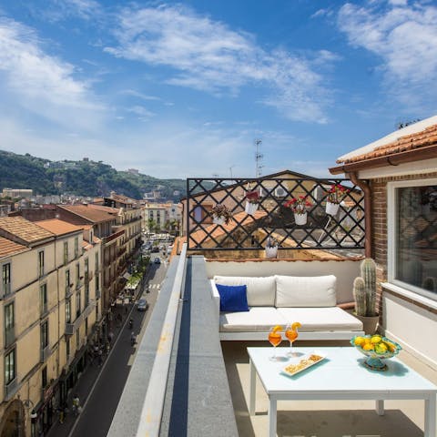 Sip limoncello while admiring the bustling Corso Italia