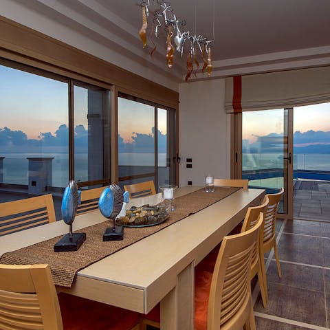 Enjoy some local Greek-inspired dinner as the sun sets over the seascape