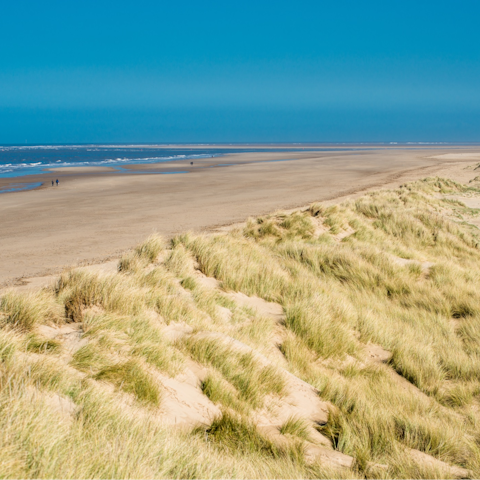 Walk just twenty minutes to the fabulous sandy beaches of Norfolk's coast