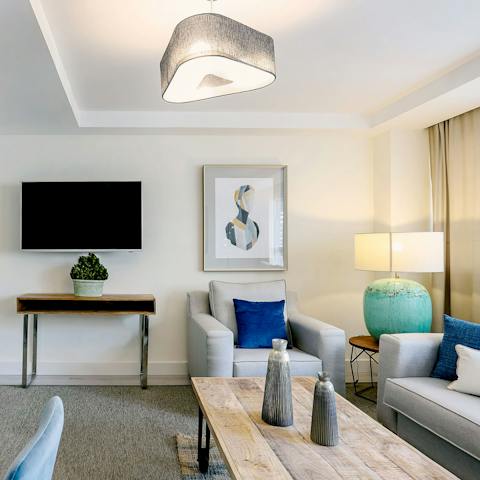 Unwind in this snug area and chat about your adventures around the coffee table