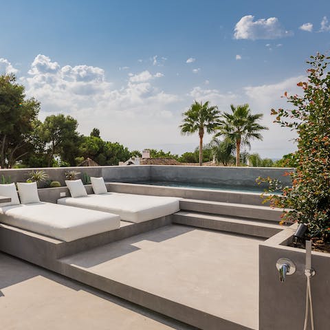 Watch the sunrise and set across the sea from the serene rooftop