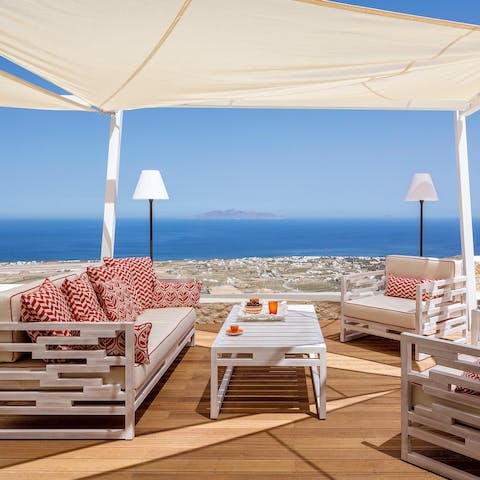 Admire the view as you relax with wine and nibbles