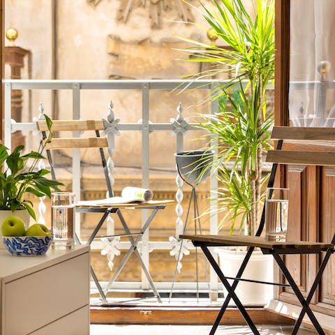 Enjoy a glass of tinto de verano on the balcony