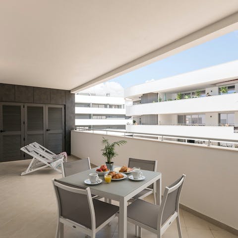Tuck into an alfresco breakfast on the balcony