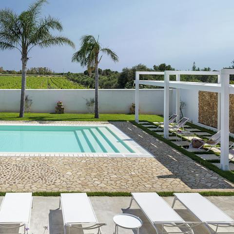 Soak up the Sicilian sun by the saltwater swimming pool