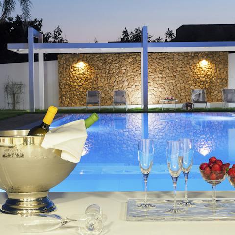 Enjoy the stillness of the evening and share a bottle of wine by the pool