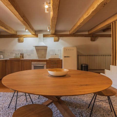 Tuck into traditional paella dishes and drink sangria around the dining table