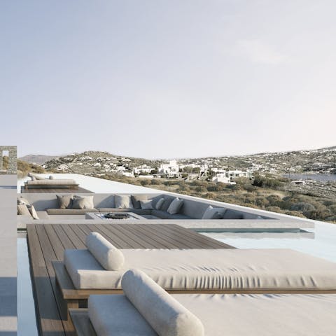 Gather around the fire pit in this uniquely sunken seating area right in the swimming pool