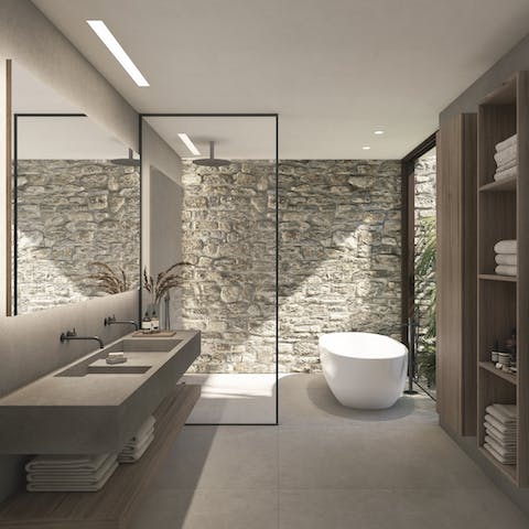 Treat yourself to a soak in the freestanding tub right by the window