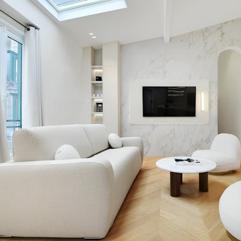 Sprawl out in the sleek living area after a long day on your feet