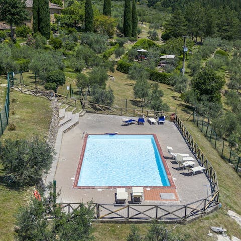 While away the hours by the communal swimming pool
