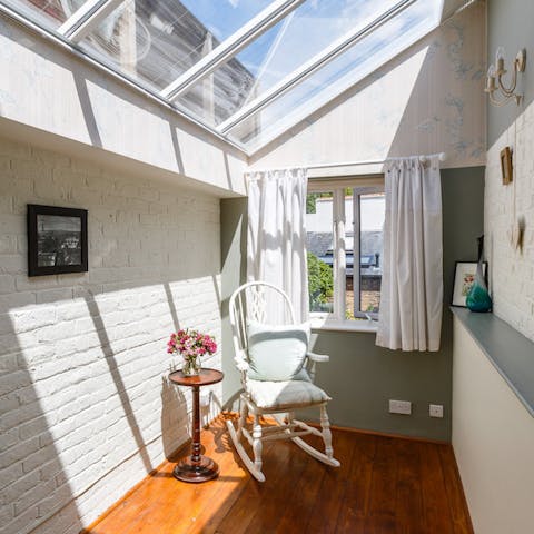 Find a calming spot to read in the conservatory