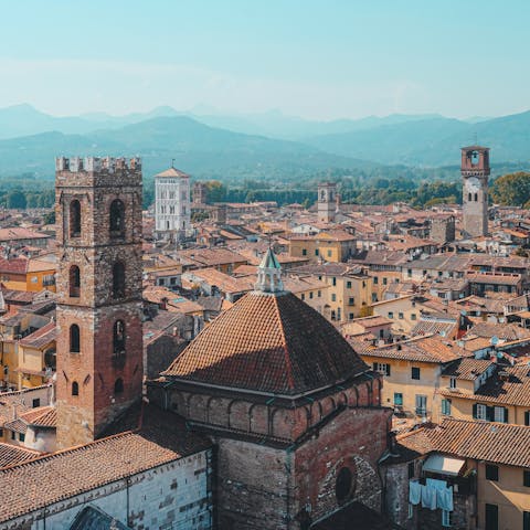 Drive twenty minutes to Lucca and explore the ancient city