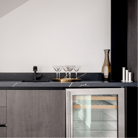 Make yourself a drink in the stylish bar