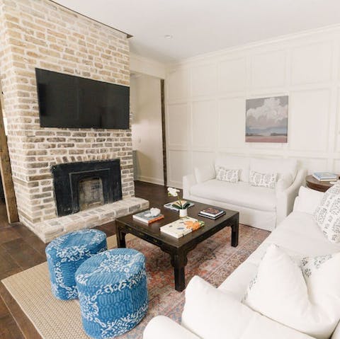 Get cosy in front of the feature fireplace