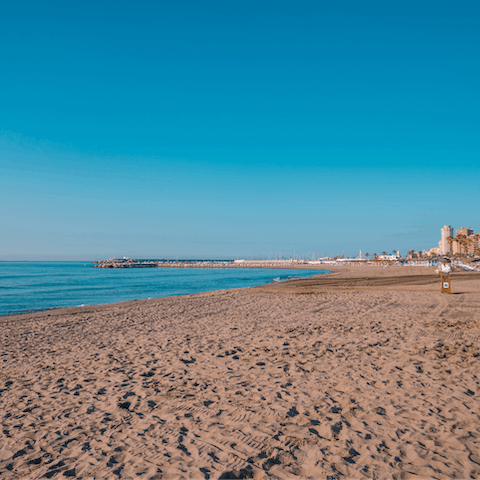 Walk to Playa de la Torre for a day on the sand