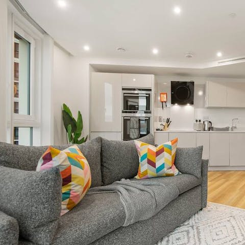 Relax in your light-filled apartment, high above the hustle and bustle of the city streets below