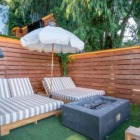 Relax in utter seclusion on the day beds by the fire pit