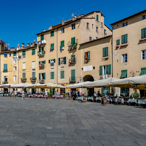 Stroll seven minutes to the Piazza dell'Anfiteatro
