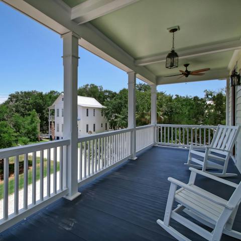 Sip cool drinks on the veranda with treetop views