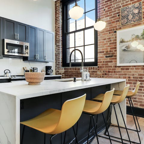 Sit up at the stylish breakfast bar while the chef of the group whisks up breakfast