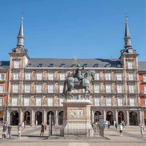 Stroll to Plaza Mayor to people-watch while sipping coffee