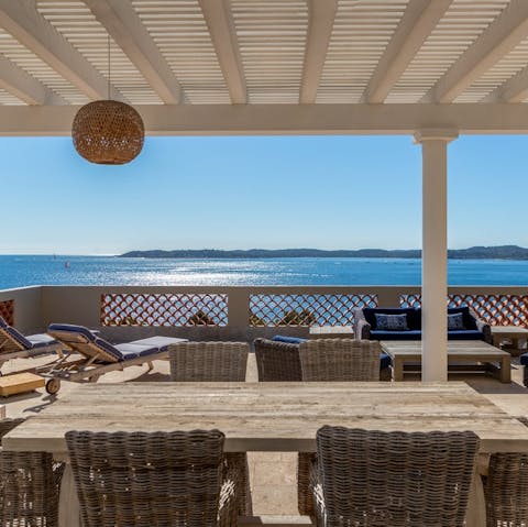 Enjoy idyllic sunset views while sipping drinks on the terrace