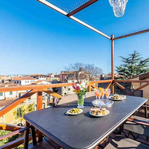 Sip Spritz on the rooftop terrace