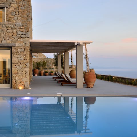 Watch the sunset from the sun loungers before taking a refreshing dip