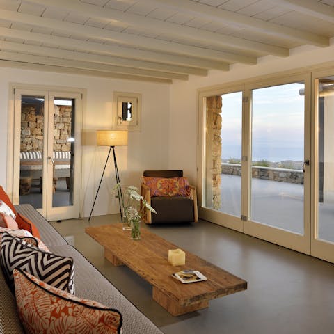 Open the floor-to-ceiling doors and get comfortable with a book