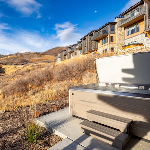 Warm up in the hot tub as the Wasatch Range stretches out ahead
