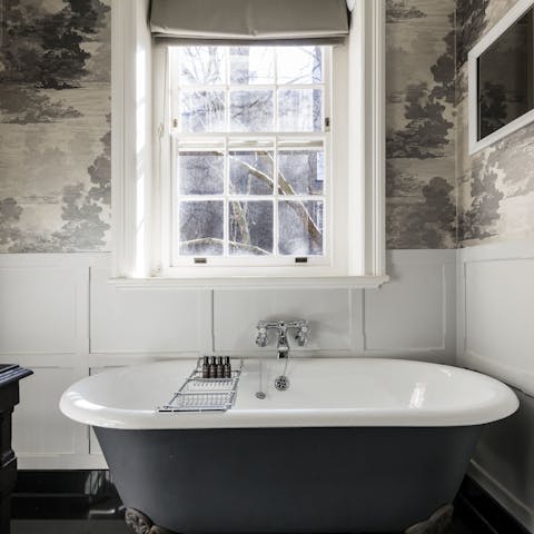 Unwind after sightseeing with a long soak in the freestanding bath