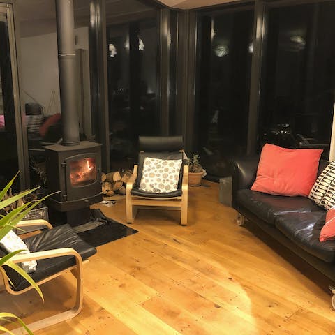 Enjoy cosy evenings by the fire in the elegant living area