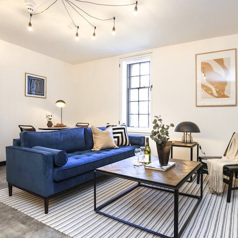 Kick back with a glass of wine under the stylish, industrial lighting