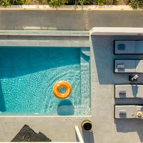 Splash about in the infinity pool and dry off on one of the loungers