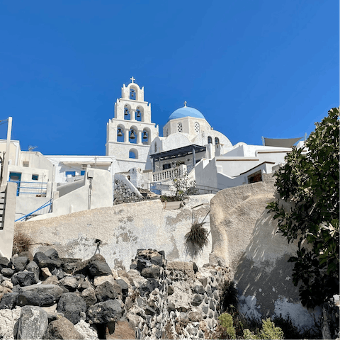 Wander about the traditional Santorinian architecture in Pyrgos, only a quarter of