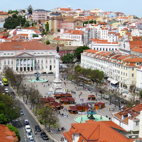 Have a drink at one of the atmospheric cafés on Rossio Square, a three-minute walk away
