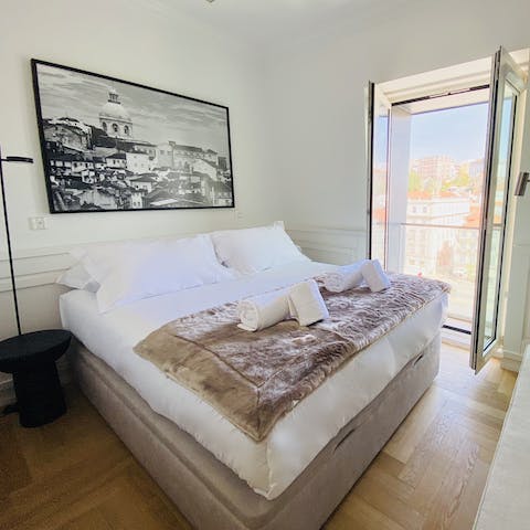 Open the French doors to the Juliet balcony and listen to the sounds of Lisbon