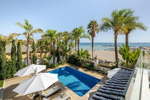 Swim in your private pool steps from the Mediterranean shore