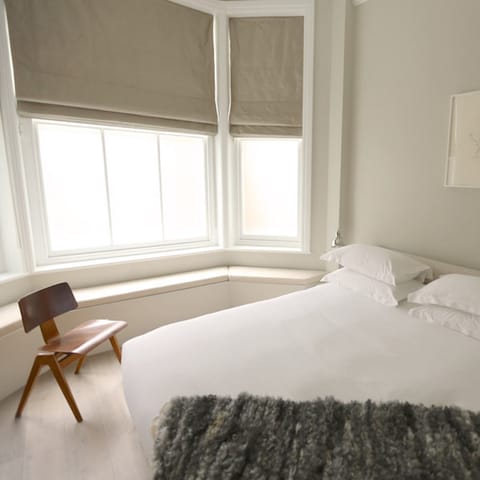 Wake up to natural light flooding in through the bay window