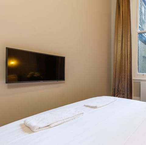 Enjoy some TV in bed