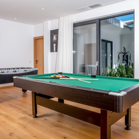 Let your competitive side shine with a game of pool or foosball in the games room