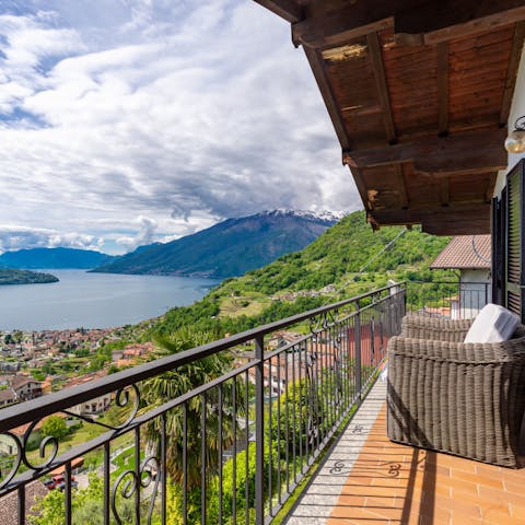 Admire the wonderful views of the lake and mountains from the private balcony