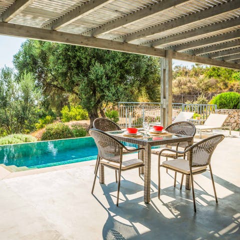 Enjoy freshly grilled alfresco meals beneath the pergola