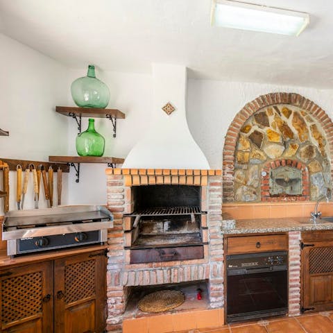 Cook up a grilled feast on the plancha and open fire pit