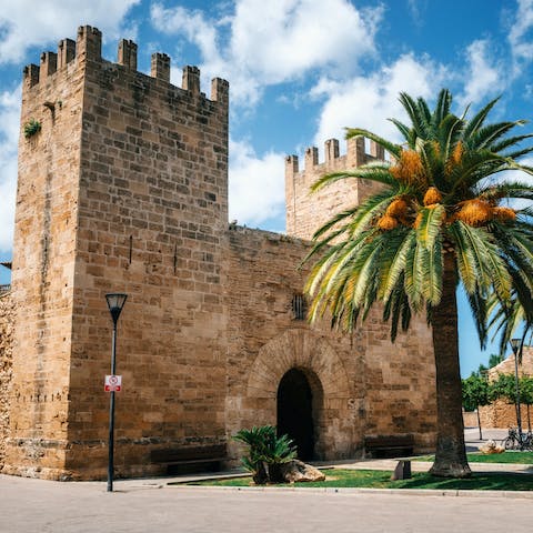 Spend an afternoon exploring Alcúdia old town, less than a ten-minute drive away