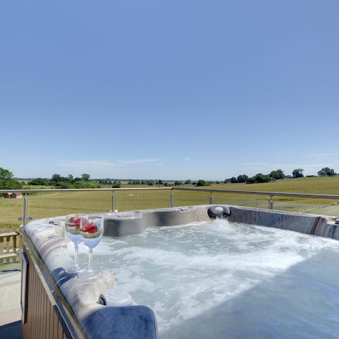Bubble your troubles away in the hot tub as you drink in the incredible scenery