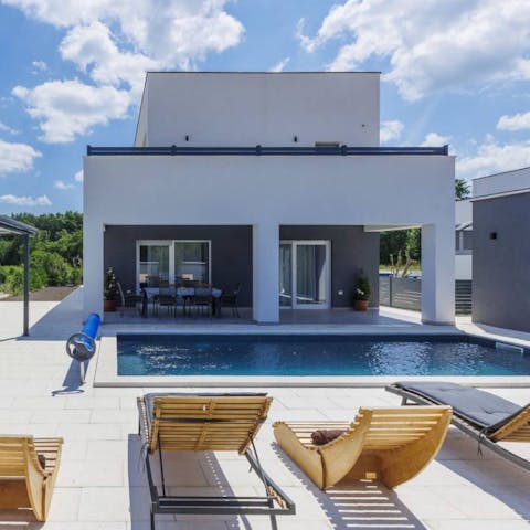 Spend relaxed days by the private pool