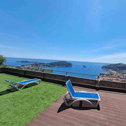 Sunbathe alongside sea views