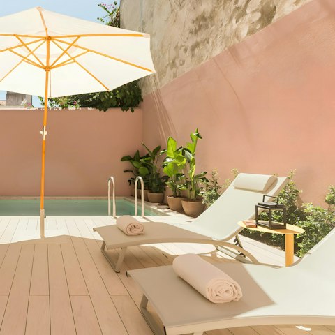 Soak up Lisbon's sunshine from the private poolside